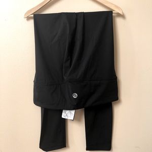 New with tags high rise athletic/yoga leggings.  Size XXL.  Solid black color.